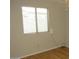 Bedroom with a window offering natural light and plank flooring at 20479 N 105Th Ave, Peoria, AZ 85382