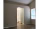 Bedroom boasts wood floors and an ensuite bathroom with tub and shower at 20479 N 105Th Ave, Peoria, AZ 85382