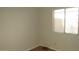 Bedroom featuring carpet flooring and a window with natural light at 20479 N 105Th Ave, Peoria, AZ 85382