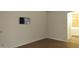 Bedroom features wood floors and a wall mounted tv, with bathroom attached at 20479 N 105Th Ave, Peoria, AZ 85382