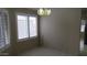 Cozy dining area featuring decorative light fixture and shuttered window at 20479 N 105Th Ave, Peoria, AZ 85382