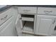 White kitchen cabinets feature pull out storage for convenient organization at 20479 N 105Th Ave, Peoria, AZ 85382