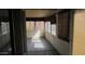 Sunroom interior, flooded with natural light through multiple windows and blinds, offers a relaxing atmosphere at 20479 N 105Th Ave, Peoria, AZ 85382