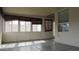 Well-lit sunroom with a series of windows and blinds, creating a comfortable and versatile space at 20479 N 105Th Ave, Peoria, AZ 85382