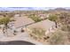 Aerial view of desert community featuring well-maintained landscaping and tile roofs at 2212 W Calle De Las Estrella St, Phoenix, AZ 85085