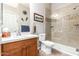 Bathroom featuring a glass-enclosed shower with tiled walls, a wood vanity, and a toilet at 2212 W Calle De Las Estrella St, Phoenix, AZ 85085