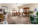 Elegant dining room features a classic table setting, traditional decor, and plush carpeting at 2212 W Calle De Las Estrella St, Phoenix, AZ 85085