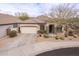 Charming single-story home with a two-car garage, desert landscaping, and a tile roof at 2212 W Calle De Las Estrella St, Phoenix, AZ 85085