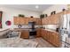 Well-equipped kitchen with stainless steel appliances, ample cabinetry, and neutral countertops at 2212 W Calle De Las Estrella St, Phoenix, AZ 85085