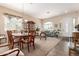 Inviting living room with ample natural light, dining area, and neutral color scheme at 2212 W Calle De Las Estrella St, Phoenix, AZ 85085