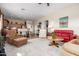 Bright living room featuring neutral walls, carpeted floor, and modern furniture throughout the open floor plan at 2212 W Calle De Las Estrella St, Phoenix, AZ 85085