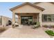 Charming covered patio with brick pavers, ceiling fan and outdoor furniture at 2212 W Calle De Las Estrella St, Phoenix, AZ 85085