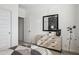 Comfortable bedroom with a space-themed mirror, modern dresser, and telescope for stargazing at 23984 W Cocopah St, Buckeye, AZ 85326