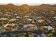 Panoramic aerial view of luxury homes in the desert landscape with mountains at 25031 N Paso Trl, Scottsdale, AZ 85255