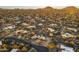 Desert homes with solar panels and a winding road create an image of community and sustainability at 25031 N Paso Trl, Scottsdale, AZ 85255