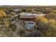 Aerial view showcasing a private backyard oasis, featuring a sparkling pool, spa, and covered patio perfect for relaxing at 25031 N Paso Trl, Scottsdale, AZ 85255