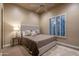 Bedroom featuring a statement headboard and natural lighting at 25031 N Paso Trl, Scottsdale, AZ 85255