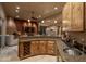 Open-concept living space showcasing a bar with custom cabinetry, ideal for entertaining guests at 25031 N Paso Trl, Scottsdale, AZ 85255