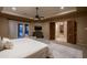 Serene main bedroom with plush carpeting, backyard access, and ensuite access at 25031 N Paso Trl, Scottsdale, AZ 85255