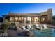 Backyard oasis with relaxing pool, in-pool seating, covered patio, and beautifully landscaped grounds at 25031 N Paso Trl, Scottsdale, AZ 85255
