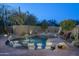 Backyard swimming pool with desert landscaping at 25031 N Paso Trl, Scottsdale, AZ 85255
