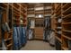 Well-organized walk-in closet with custom shelving and ample storage space for clothing and accessories at 25031 N Paso Trl, Scottsdale, AZ 85255