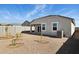View of backyard featuring low maintenance landscaping, and covered patio at 25443 W Graham Trl, Buckeye, AZ 85326