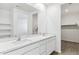Bathroom featuring double sink vanity and large mirror at 25443 W Graham Trl, Buckeye, AZ 85326
