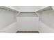 Walk-in closet featuring shelving, a hanging rod and carpet at 25443 W Graham Trl, Buckeye, AZ 85326