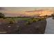A view of a park in the Copper Falls community featuring playground and greenery at 25443 W Graham Trl, Buckeye, AZ 85326