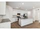 Modern kitchen featuring stainless steel appliances, island and granite countertops at 25443 W Graham Trl, Buckeye, AZ 85326