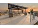 Community picnic area with covered tables, BBQ grills, and bike racks at 25443 W Graham Trl, Buckeye, AZ 85326