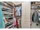 Walk-in closet with custom wood shelving and storage for a modern and organized space at 28990 N White Feather E Ln # 182, Scottsdale, AZ 85262
