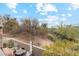 View from the patio showcasing an outdoor dining area and desert landscape beyond at 28990 N White Feather E Ln # 182, Scottsdale, AZ 85262