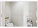Small, simple powder room featuring neutral colors, compact sink, and toilet with storage at 28990 N White Feather E Ln # 182, Scottsdale, AZ 85262