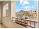 Balcony view showcasing desert landscaping, rock formations, and a glimpse of the community architecture at 28990 N White Feather E Ln # 182, Scottsdale, AZ 85262