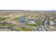 Community aerial view featuring a pool, tennis courts, roundabout, and well-maintained landscaping at 30419 N Plantation Dr, San Tan Valley, AZ 85143
