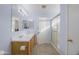 Light and bright bathroom featuring double sinks, tile floors, and a glass shower enclosure at 30419 N Plantation Dr, San Tan Valley, AZ 85143