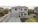 Charming two-story home featuring an attached two-car garage and low maintenance landscaping at 30419 N Plantation Dr, San Tan Valley, AZ 85143