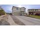 Inviting two-story home with a large driveway leading to a two-car garage and a cozy front yard at 30419 N Plantation Dr, San Tan Valley, AZ 85143