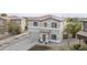 Well-maintained two-story home with a spacious driveway, two-car garage, and landscaped front yard at 30419 N Plantation Dr, San Tan Valley, AZ 85143