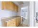 Hallway with cabinets leading to a bathroom with a tub and shower at 30419 N Plantation Dr, San Tan Valley, AZ 85143