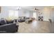 Bright living room featuring tile flooring, a ceiling fan, and comfortable seating arrangements at 30419 N Plantation Dr, San Tan Valley, AZ 85143