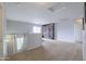 Bright loft space featuring a large window and neutral walls and flooring at 30419 N Plantation Dr, San Tan Valley, AZ 85143