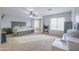 Spacious bedroom offering neutral carpet, ceiling fan, and lots of natural light at 30419 N Plantation Dr, San Tan Valley, AZ 85143