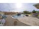Backyard pool featuring an appealing waterfall, patio and bar at 30419 N Plantation Dr, San Tan Valley, AZ 85143