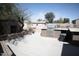 This backyard features a built-in grill and plenty of space for entertaining at 3721 N Brindley Ave, Litchfield Park, AZ 85340