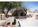 This backyard features a built-in fireplace and plenty of space for entertaining at 3721 N Brindley Ave, Litchfield Park, AZ 85340