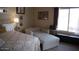 Comfortable bedroom with soft lighting and floral bedspread at 3721 N Brindley Ave, Litchfield Park, AZ 85340