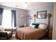 Comfortable bedroom with natural light, ceiling fan, and tasteful decor at 3721 N Brindley Ave, Litchfield Park, AZ 85340